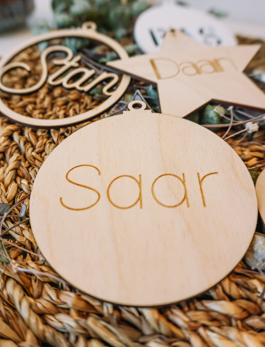 Houten kerstbal met boodschap